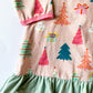 Close-up of festive Christmas print on girls holiday tunic
