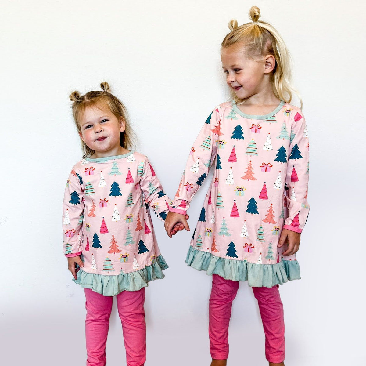Girls Christmas two piece outfit with festive print tunic and pink leggings