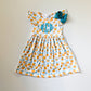 Girls Monogrammed Orange Print Dress with Bow: Embroidered Summer Outfit