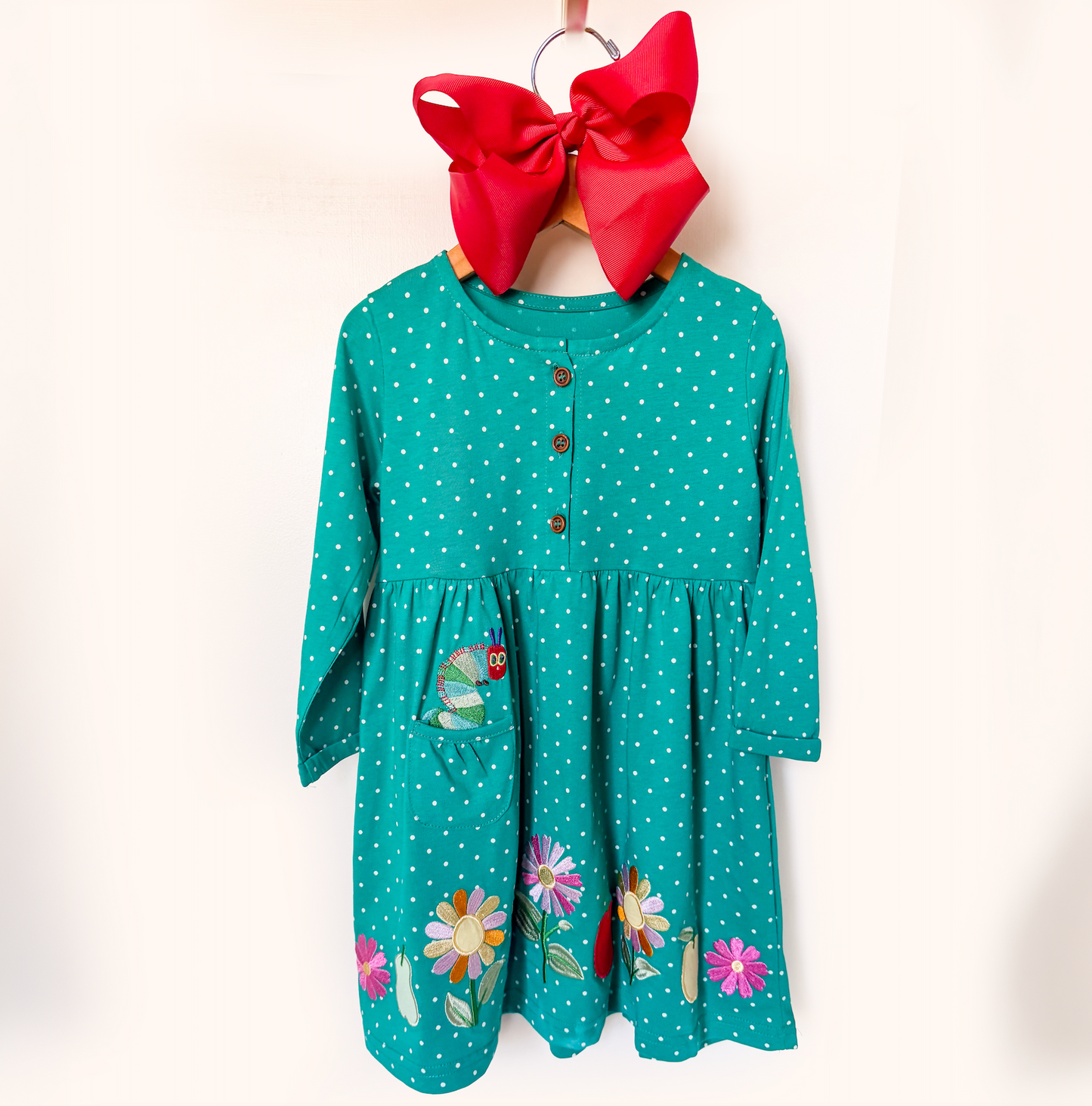 Girls teal polka dot caterpillar embroidered dress with floral hem