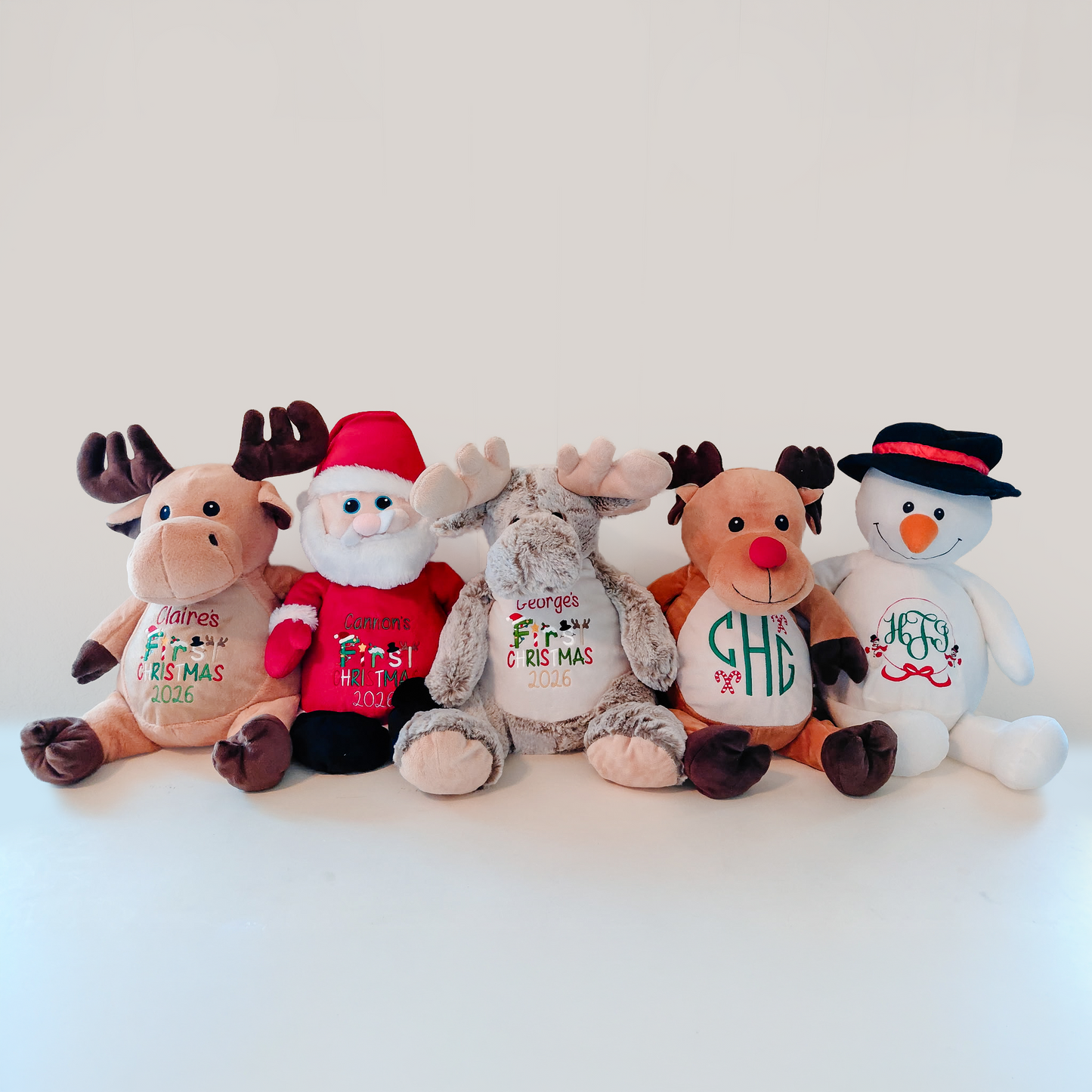 Personalized embroidered Christmas plush toys — reindeer, Santa, fluffy reindeer, Rudolph, and snowman